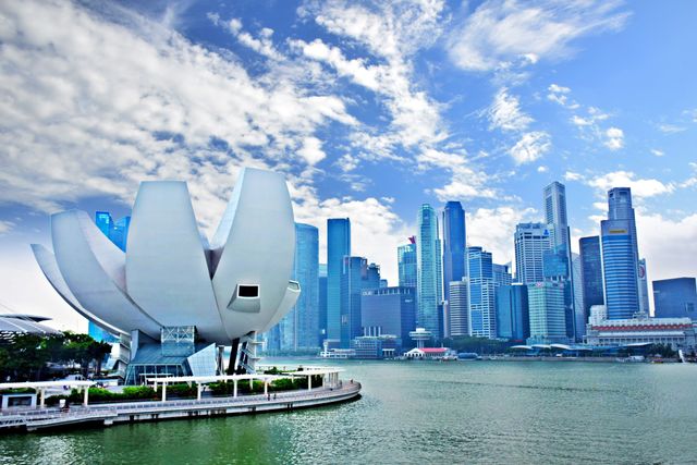 Marina Bay in Singapore features both modern architectural masterpieces and a skyline brimming with skyscrapers. The unique structure with an innovative design alongside the city’s business district highlights Singapore as a major global financial hub. Use images like this for travel promotions, architectural studies, urban planning presentations, and publications showcasing modern cityscapes.