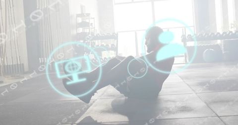 Man doing crunches with holographic fitness overlay in backlit minimalist gym studio