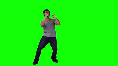 Man Singing with Microphone Green Background
