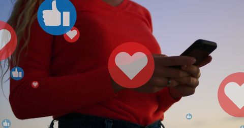 Person Interacting with Social Media Likes on Smartphone