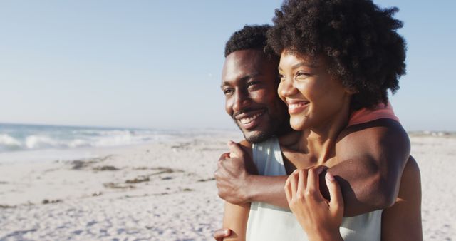 Happy couple embracing on a sunny beach - Download Free Stock Images Pikwizard.com