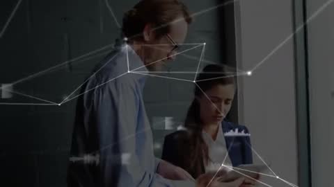 Professionals Analyzing Data on Digital Tablet in Modern Office