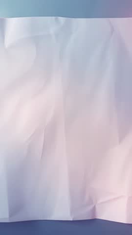 Vertical soft-lit crumpled paper backdrop showing folds and pastel gradient shadows