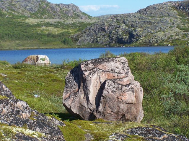 Serene Lake with Boulders and Rocky Landscape on a Sunny Day - Download Free Stock Photos Pikwizard.com