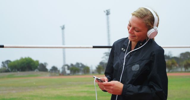 Young Woman Listening to Music during Outdoor Workout - Download Free Stock Images Pikwizard.com