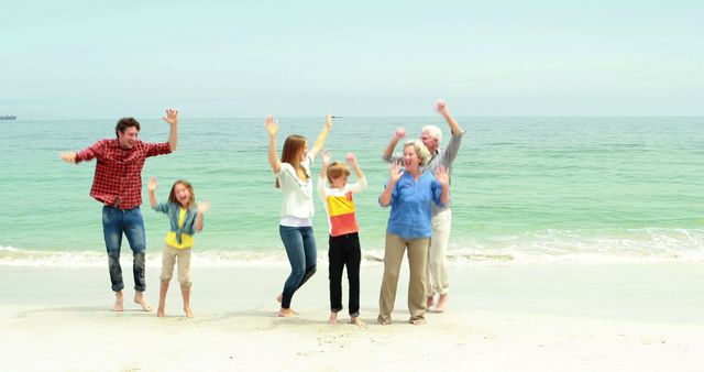 Multigenerational family joyfully jumping on beach. Ideal for promoting family vacations, beach destinations, or family life websites. Use in travel brochures, family-themed blog posts, or social media content about the joys of multigenerational bonding at the beach.