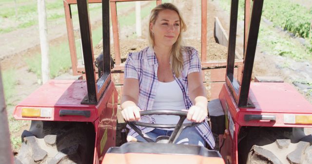 Woman driving tractor on farm - Download Free Stock Images Pikwizard.com