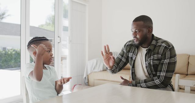 Father Teaching Son American Sign Language at Home - Download Free Stock Images Pikwizard.com