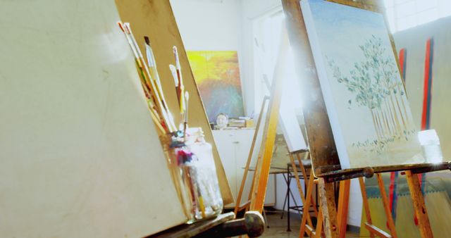Sunlit Art Studio with Canvas and Painting Supplies - Download Free Stock Images Pikwizard.com
