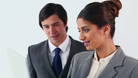 Business Professionals Discussing Project over Laptop