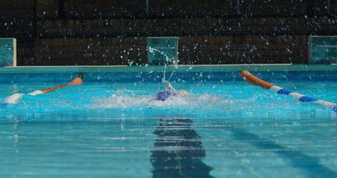 Female Swimmer Exhibiting Strength in Freestyle Technique