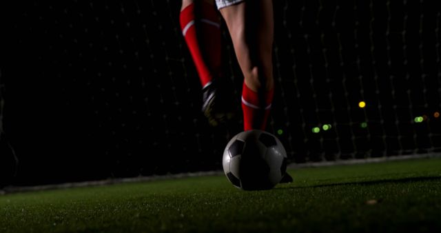 Soccer Player Dribbling Ball on Night Football Field - Download Free Stock Images Pikwizard.com