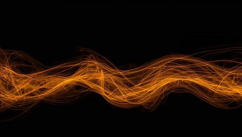 Weaving orange light ribbon flowing across black backdrop dynamic neon motion and energy