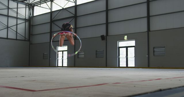 Gymnast Practicing with Hula Hoop in Indoor Sports Hall - Download Free Stock Images Pikwizard.com