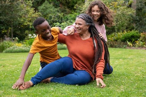 Joyful Moments with Grandmother and Grandchildren in Garden