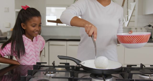 Mother and Daughter Cooking Breakfast Together in Modern Kitchen - Download Free Stock Images Pikwizard.com