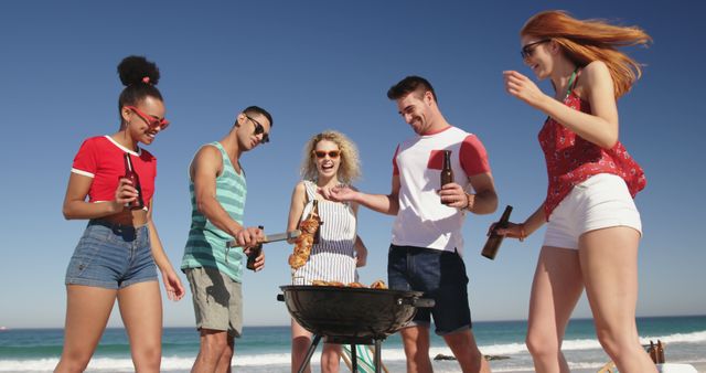 Friends Enjoying Beach Barbecue on Sunny Day - Download Free Stock Images Pikwizard.com