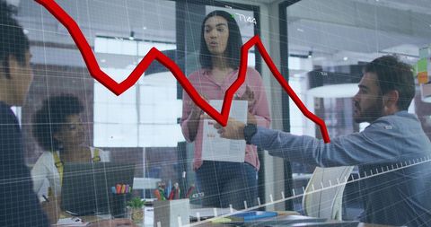 Businesswoman Analyzing Market Trends During Team Meeting - Download Free Stock Images Pikwizard.com
