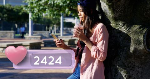 Teen Using Smartphone with Social Media Engagement in Park