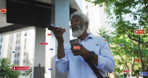 Speaking into smartphone while holding coffee commuter showing augmented reality badges