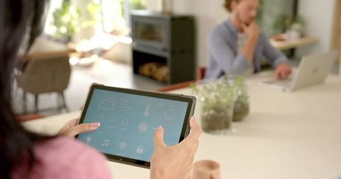 Young Couple Interacting with Technology in Modern Home Interior - Download Free Stock Images Pikwizard.com