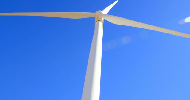 Close-Up of Wind Turbine Against Clear Blue Sky - Download Free Stock Images Pikwizard.com