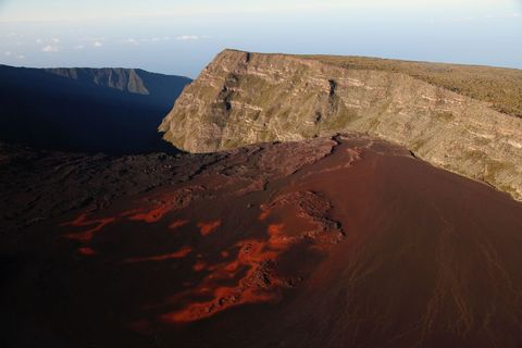 Erupting Volcano with Lava Flowing in Crater