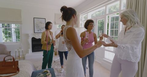 Women enjoying pre-wedding celebration with drinks