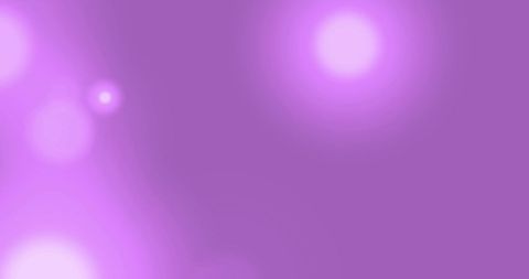 Radiant light spots on purple background