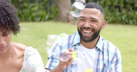 Joyful Couples Spending Time Blowing Bubbles Outdoors - Download Free Stock Images Pikwizard.com