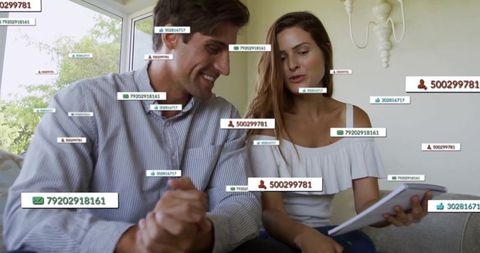 Couple Analyzing Data with Digital Overlays at Home Interior