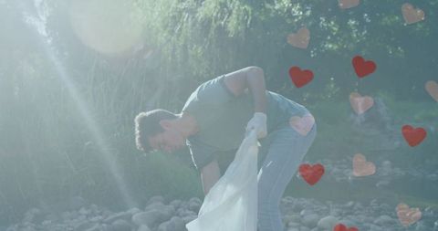Eco Volunteer Cleans Countryside with Littered Hearts Graphic - Download Free Stock Images Pikwizard.com