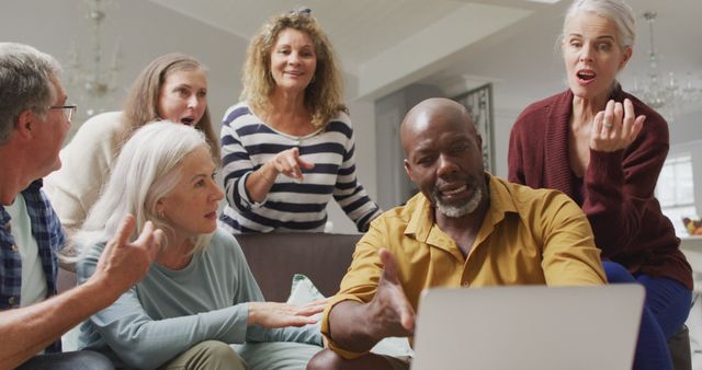 Diverse Mature Group Having Lively Discussion With Laptop at Home - Download Free Stock Images Pikwizard.com