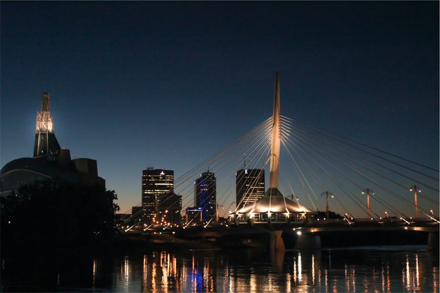 Downtown Winnipeg Skyline and Esplanade Riel Bridge at Dusk - Download Free Stock Photos Pikwizard.com