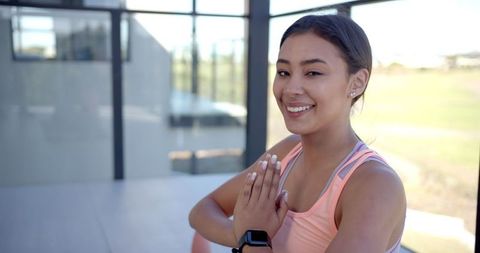 Smiling Woman Practicing Yoga in Modern Living Room