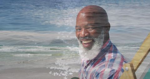 Smiling Senior Man Enjoying Relaxation by Ocean