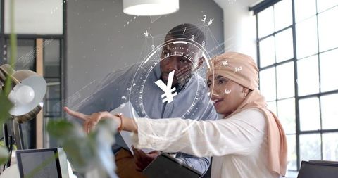 Diverse Professionals Analyzing Data with Futuristic Yen Interface in Modern Office