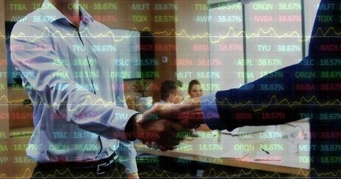 Business executives shaking hands with stock market overlay