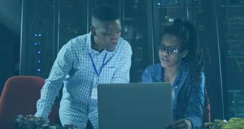 It professionals collaborating in data center