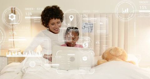 Mother and daughter sharing laptop, learning together with futuristic hud overlays on bed