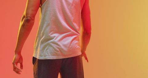 Rear View of Basketball Player on Vibrant Backdrop