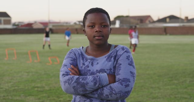 Confident Young Female Rugby Player on Practice Field at Sunset - Download Free Stock Images Pikwizard.com