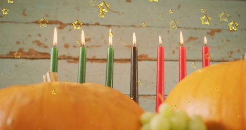 Kwanzaa Candles and Pumpkins with Golden Stars