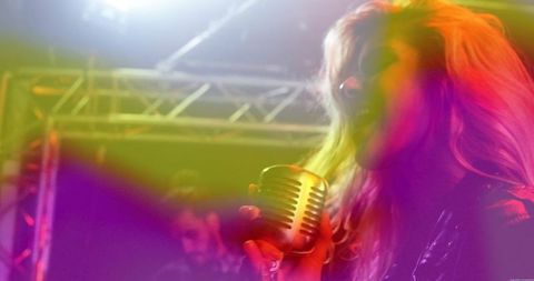 Vocalist Holding Vintage Microphone During Energetic Stage Performance