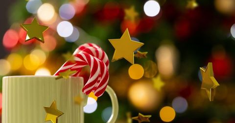 Christmas Mug and Candy Canes with Floating Golden Stars - Download Free Stock Images Pikwizard.com