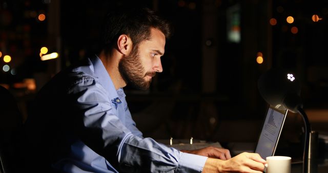 Businessman Working Late on Laptop in Office - Download Free Stock Images Pikwizard.com