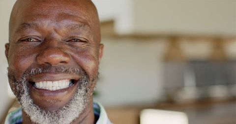 Close-Up of Smiling Mature Man Radiating Positivity - Download Free Stock Images Pikwizard.com