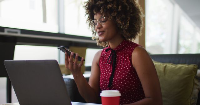 Businesswoman Working Remotely While Using Mobile Phone and Laptop - Download Free Stock Images Pikwizard.com