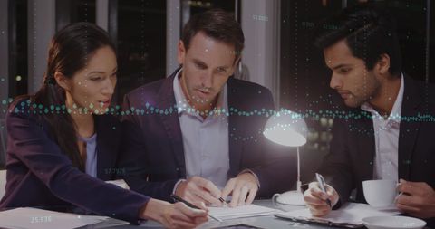 Diverse Business Team Collaborating Over Global Data Visualization