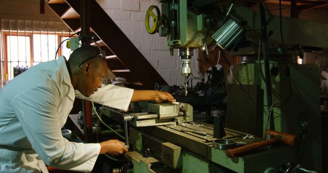 Engineer Operating Heavy Industrial Machine in Workshop - Download Free Stock Images Pikwizard.com